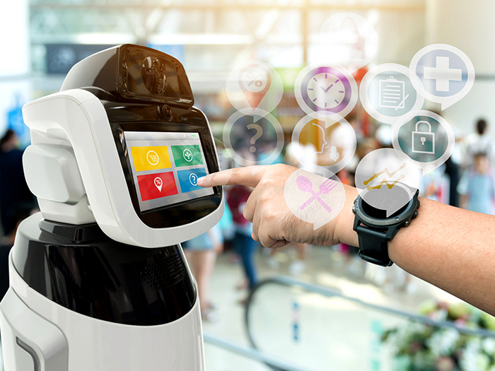 Hand with a tech watch with icons coming out pointing at a robot with buttons