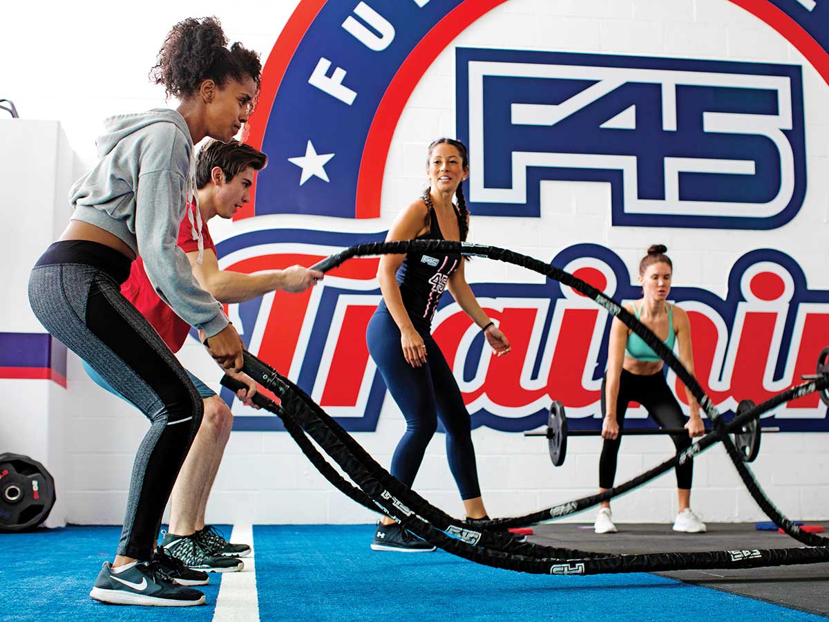 Australian fitness upstart F45 and a client in a ultra-fast “functional fitness” classes.