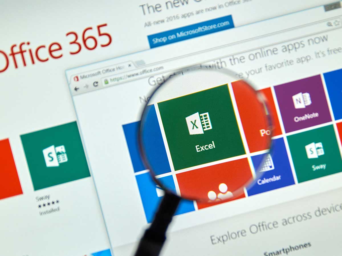 Magnifying glass in front of a Microsoft Office 365 Excel program icon on a computer screen