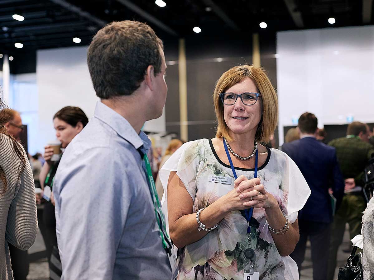 People networking and mingling at The ONE 2019 conference