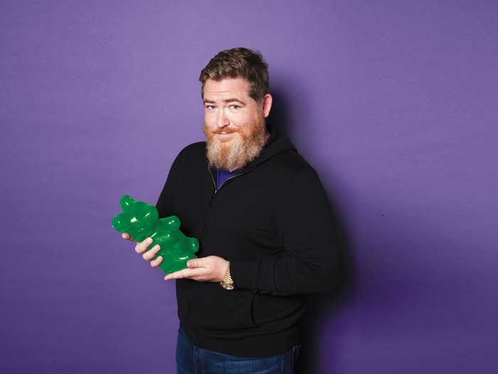 Chuck Rifici holding a gummy bear