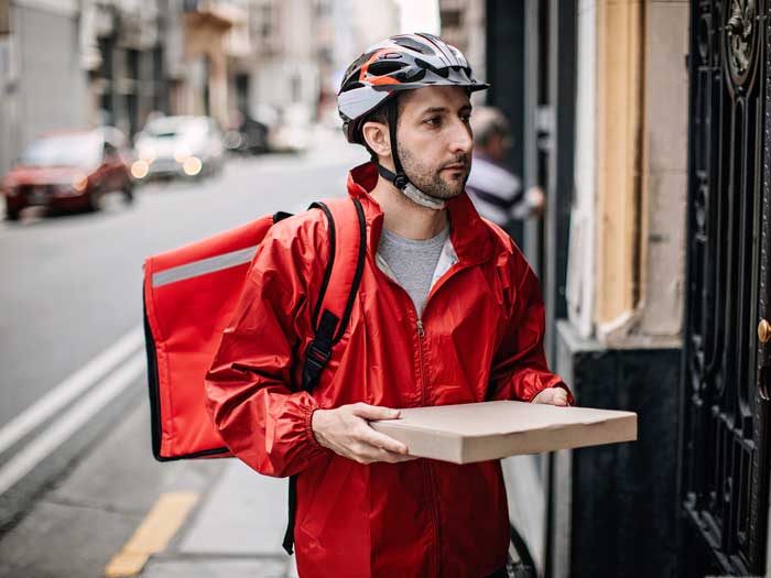 Man delivering food by bike in city