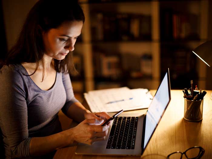 Woman working late at home