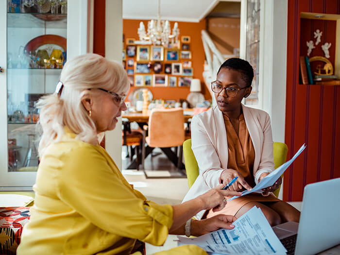 Financial advisor helping a senior woman with her finances