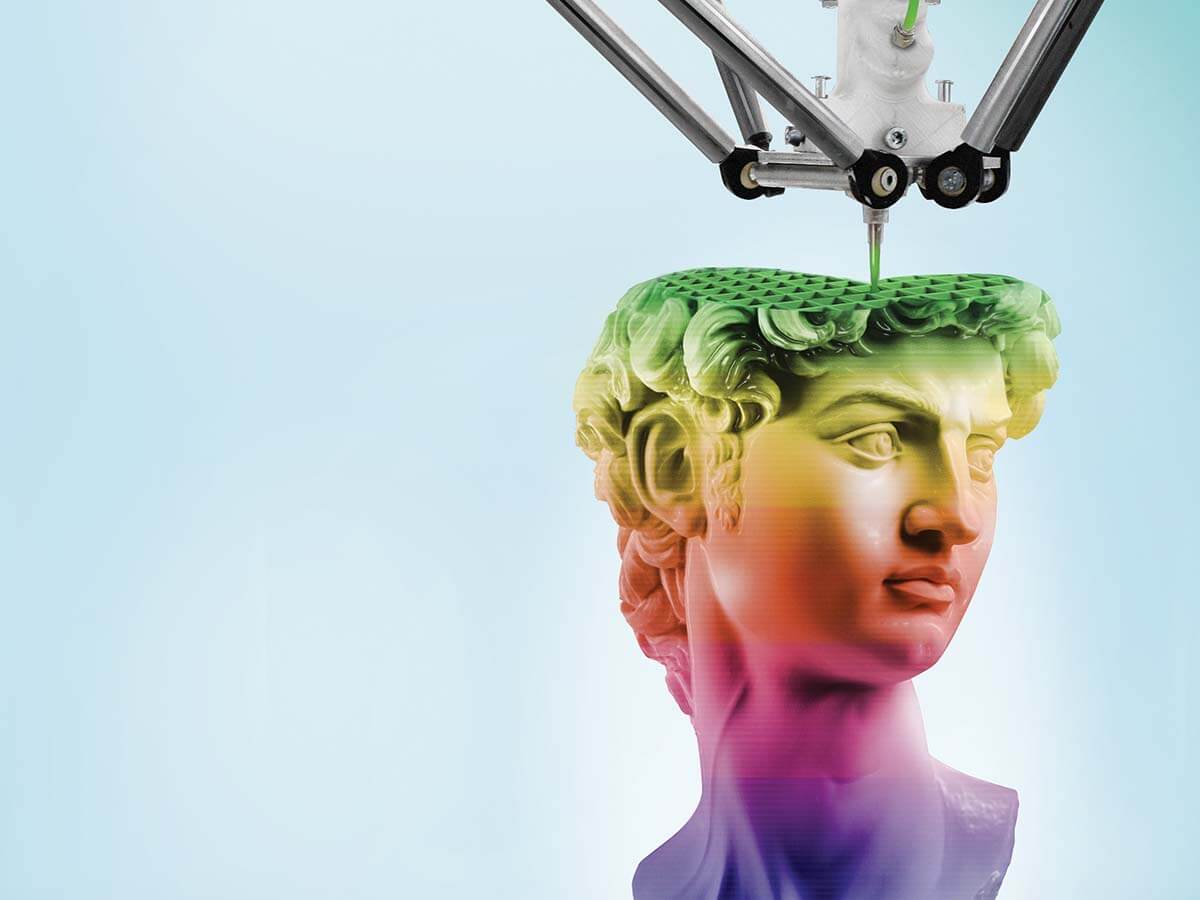 A 3D printer is shown creating a rainbow-coloured sculpture of a head