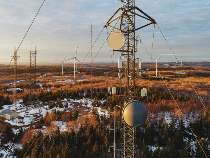 Large cell towers are shown in a rural setting