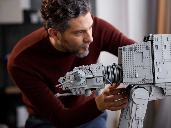 A man plays with a Star Wars LEGO set