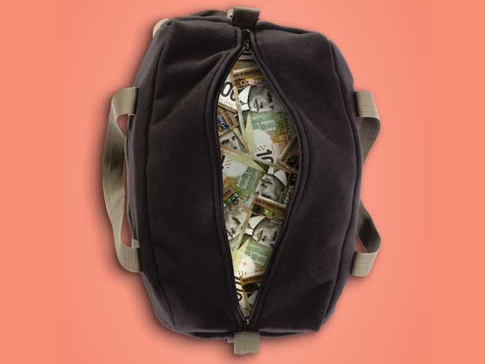 A duffle bag filled with cash in various currencies 