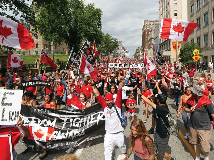 “Freedom convoy” protestors march in Ottawa