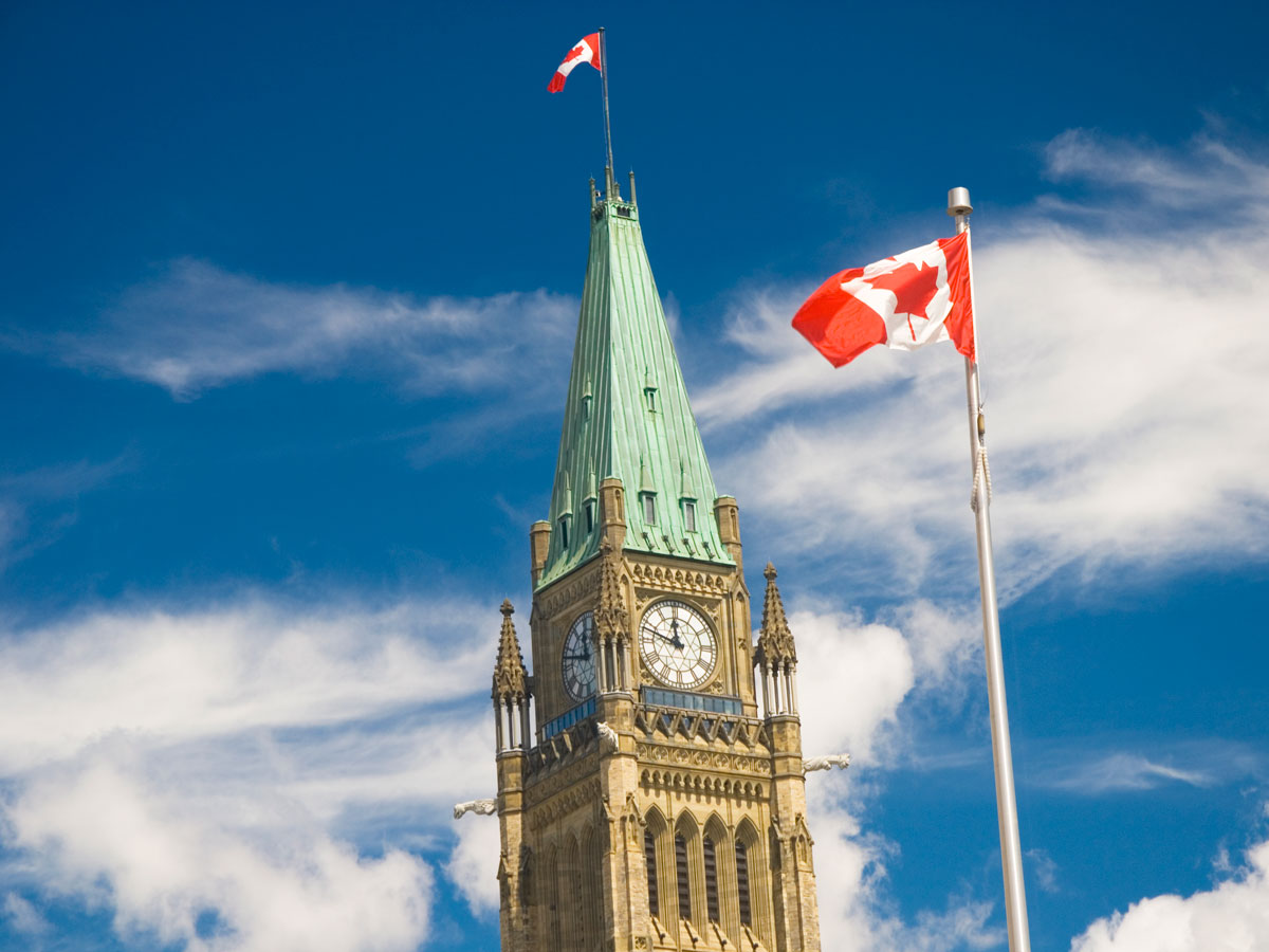 Peace Tower and Canadian flag in Ottawa, Ontario 