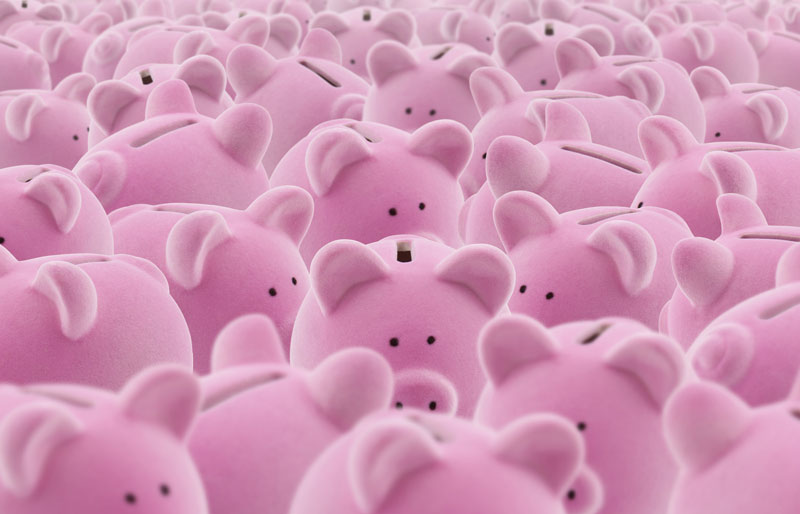 Pile of pink piggy banks sitting side-by-side