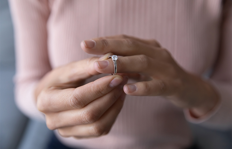 Woman holding her wedding ring