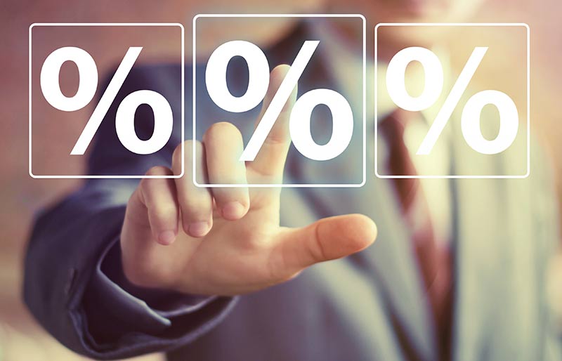 A businessman pointing at percentages. 