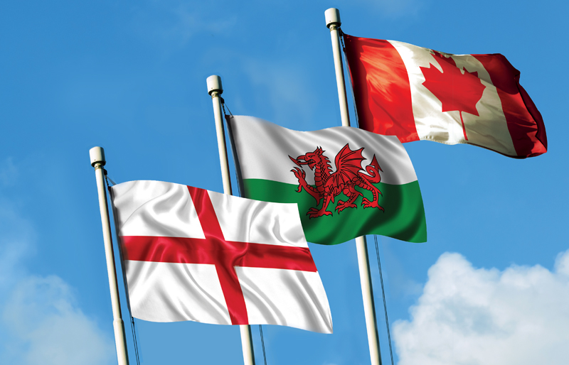 Flags of both England and Wales waving together with the Canadian flag 