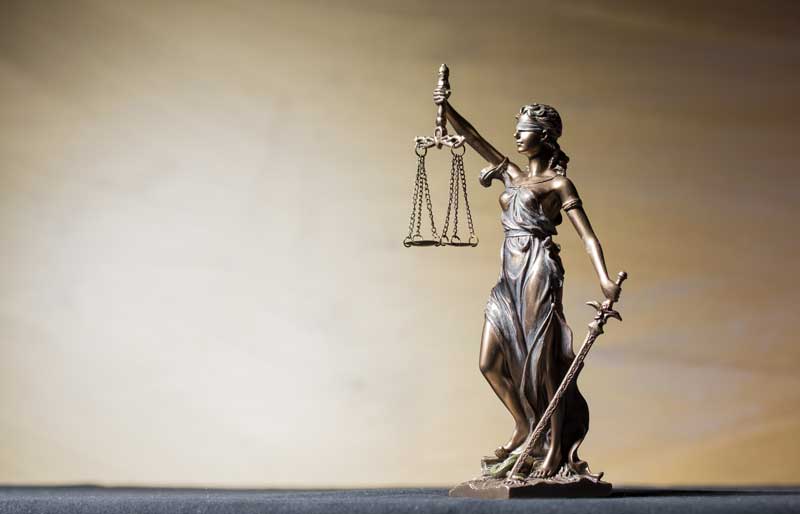 Lady justice figure on brown background