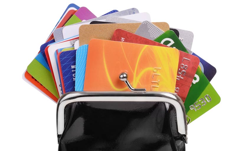 An image of a change purse with numerous loyalty cards showing. 