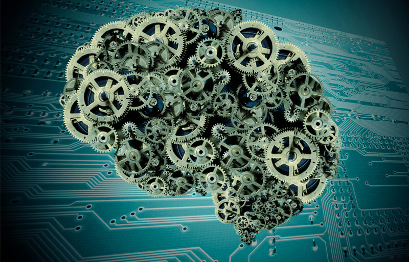 This is a concept image of a brain made from gears with a computer motherboard as a background. 