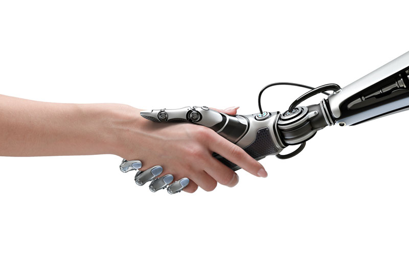 L’intelligence artificielle et les relations homme-machine sont illustrées par l’image d’une poignée de main entre une personne et un robot. 