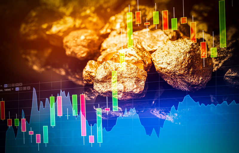 digital stocks overlay with gold nuggets in background