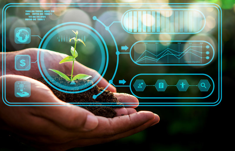 Hands holding a seedling behind a clear screen with sustainability icons.