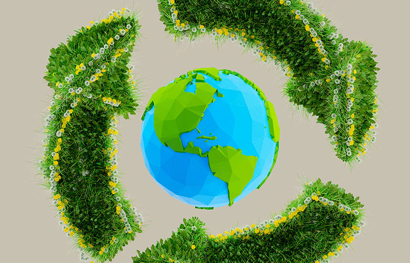 Symbole de recyclage formé d'un globe entouré de flèches vertes