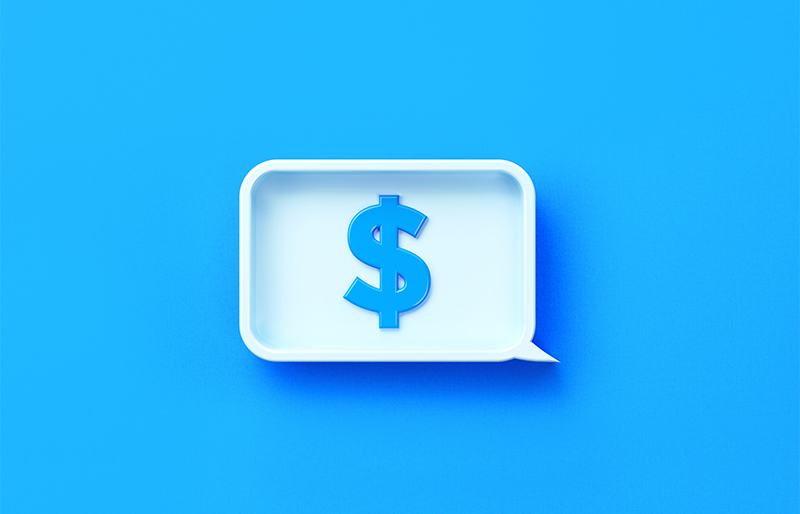 Un signe de dollar est affiché dans une bulle de conversation sur un fond bleu.