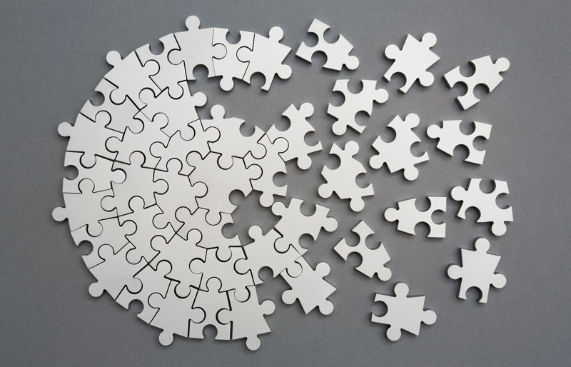 Circular jigsaw puzzle, partially put together.